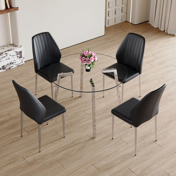Table and chair set.Modern circular transparent tempered glass table, tempered glass tabletop, silver metal table legs.A Set of 4 Black PU Comfort Dining Chairs with extended backrest.